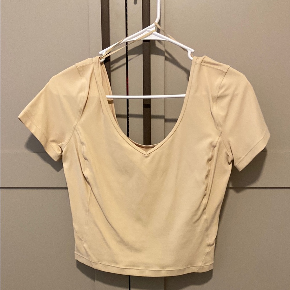 Lululemon Cream Crop Top with Scoop Neck Short Sleeves and Fitted Style